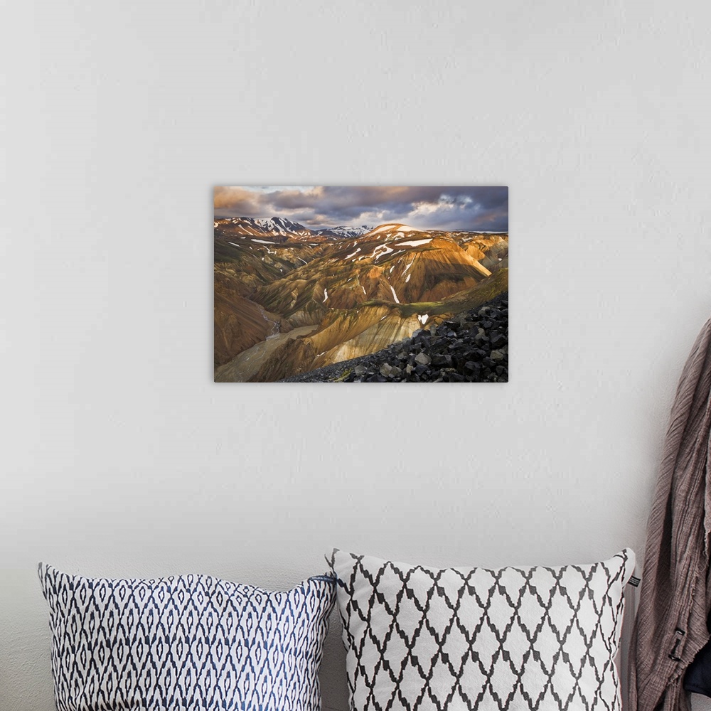 A bohemian room featuring Mountain range with snow, lit up at sunset, Iceland.