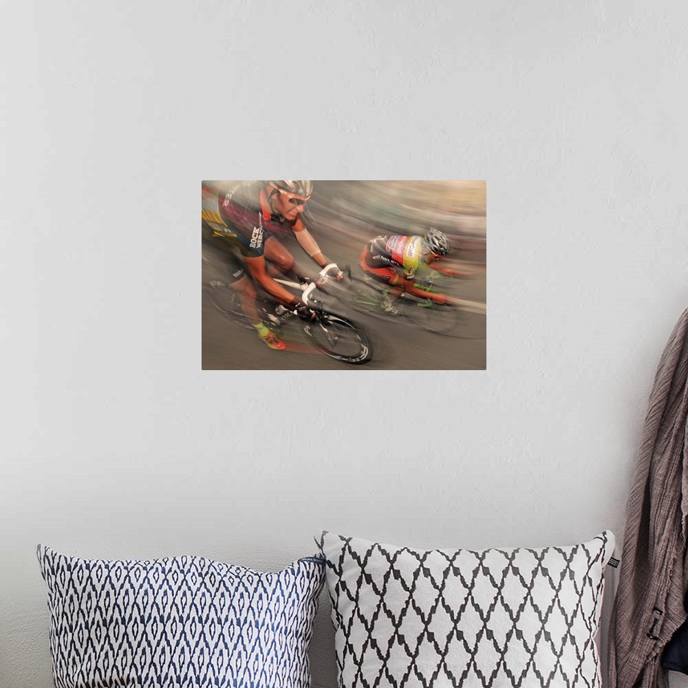 A bohemian room featuring Action shot of cyclist racing at full speed.