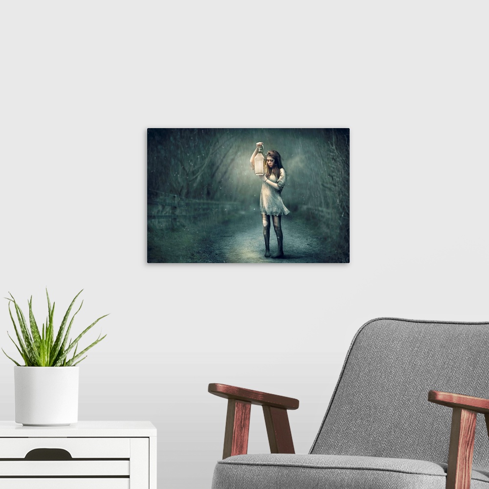 A modern room featuring A conceptual photograph of woman in tattered clothing holding a lantern in the rain.