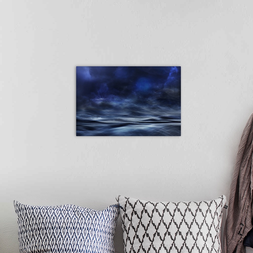 A bohemian room featuring Abstract digital art with blue, white and black hues resembling a waterscape.