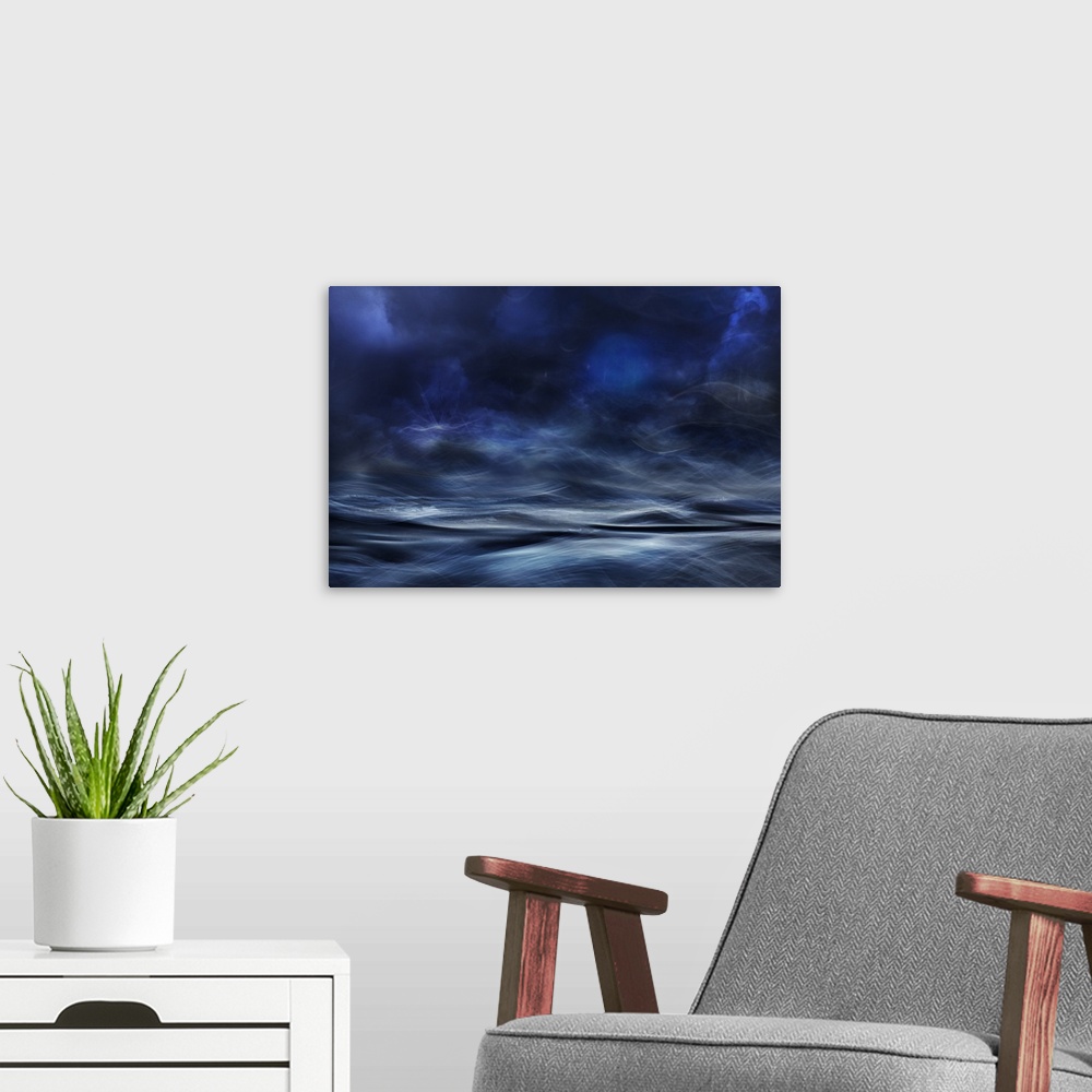 A modern room featuring Abstract digital art with blue, white and black hues resembling a waterscape.