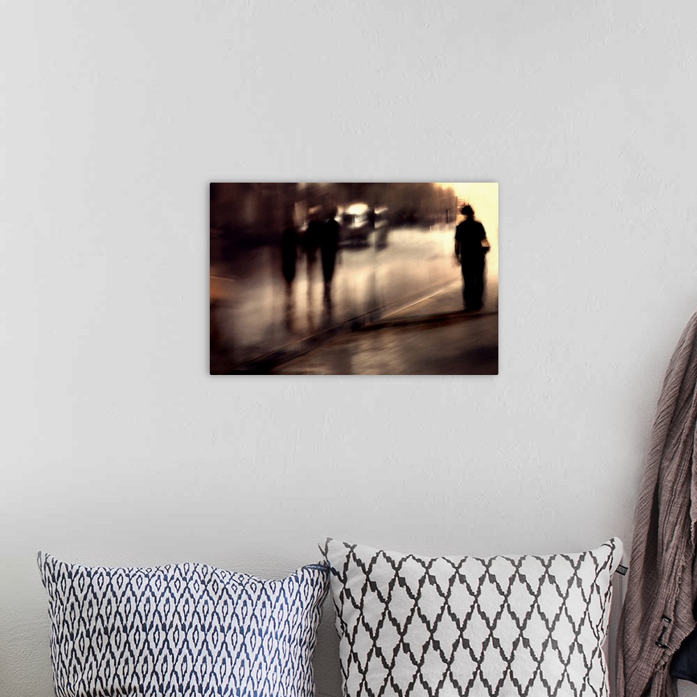 A bohemian room featuring Photo of people walking in a city street with motion blur, making them resemble shadows.