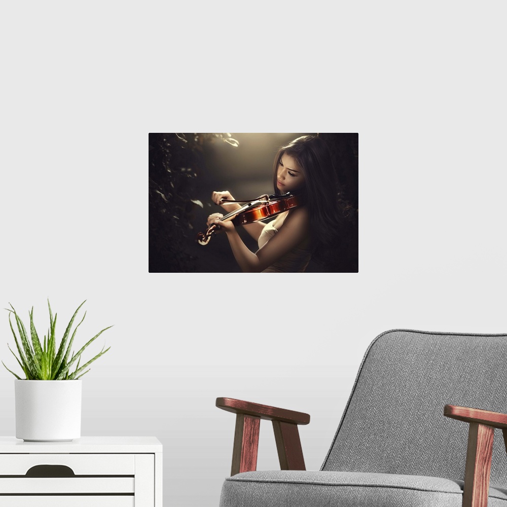 A modern room featuring A beautiful woman with long dark hair playing a violin.