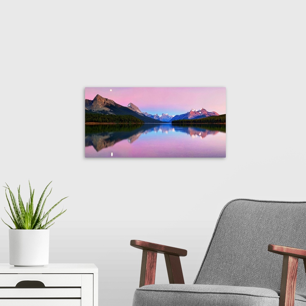 A modern room featuring Panoramic image of calm Maligne Lake in the Canadian Rockies at twilight, with a mirror reflectio...