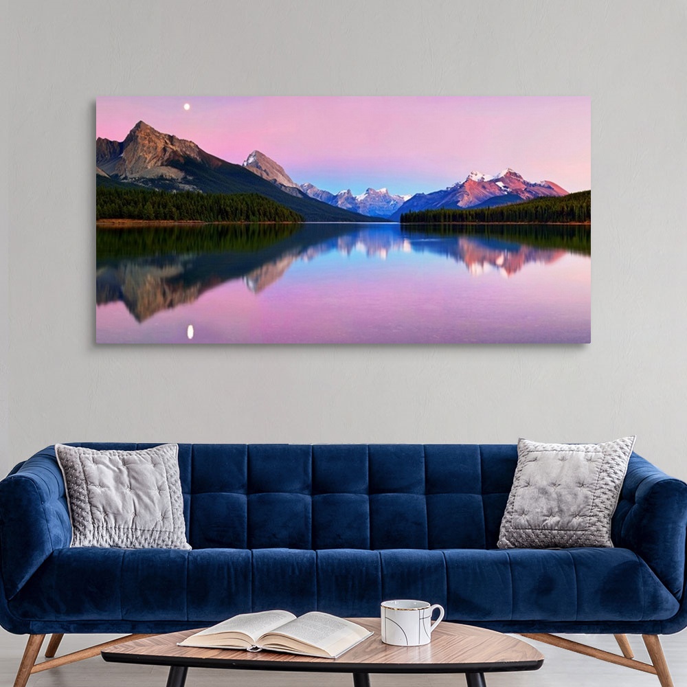 A modern room featuring Panoramic image of calm Maligne Lake in the Canadian Rockies at twilight, with a mirror reflectio...