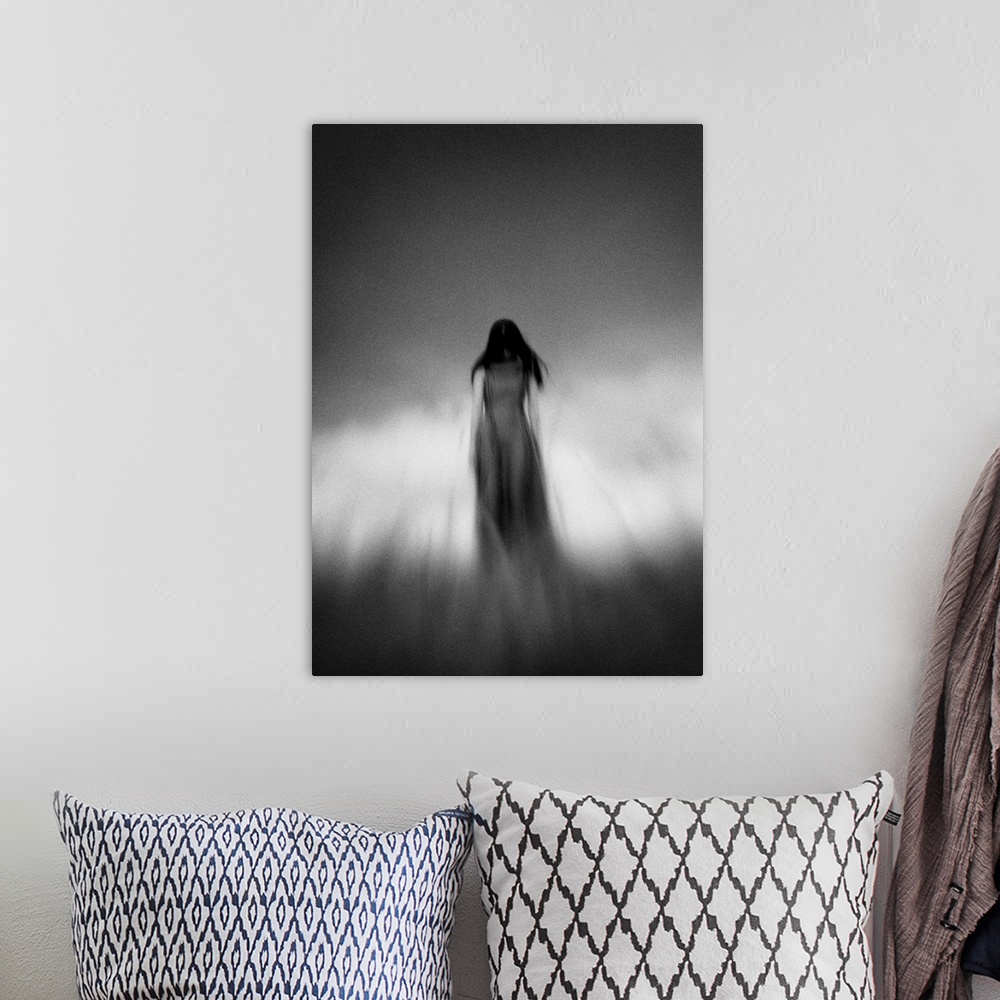 A bohemian room featuring Blurred motion image of a woman with dark hair under a cloudy sky.
