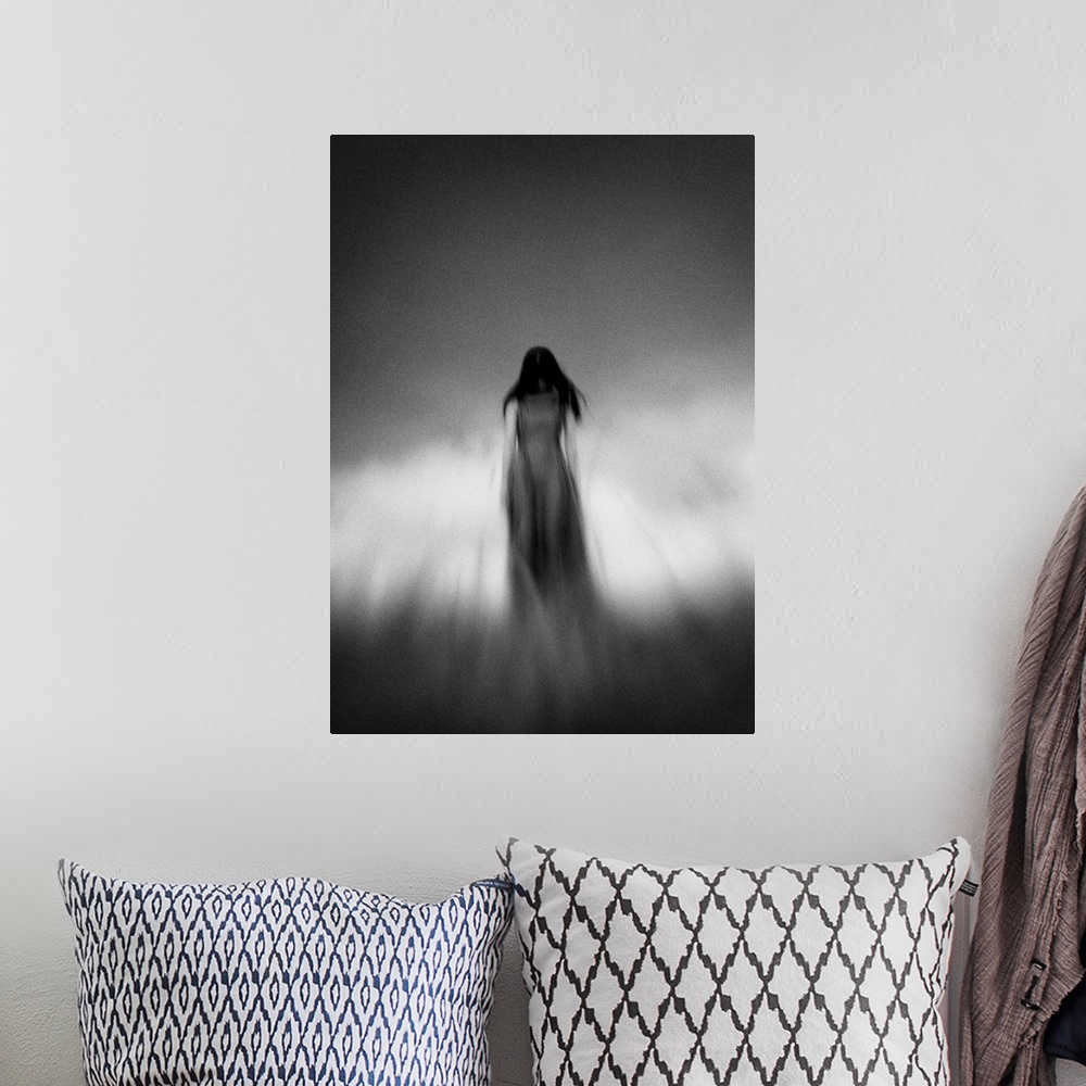 A bohemian room featuring Blurred motion image of a woman with dark hair under a cloudy sky.