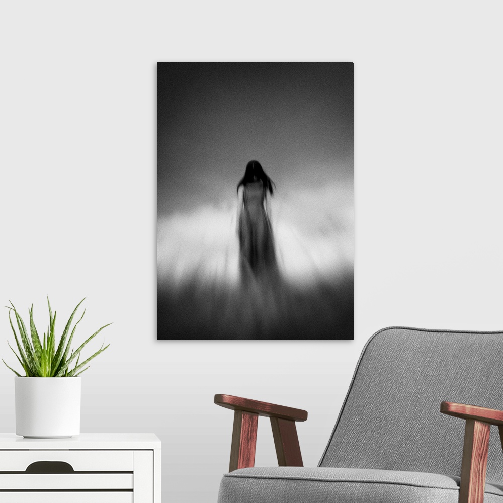 A modern room featuring Blurred motion image of a woman with dark hair under a cloudy sky.