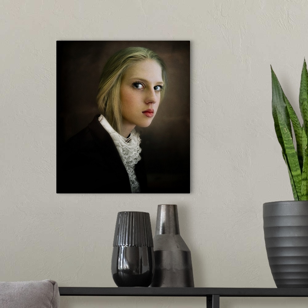A modern room featuring Portrait of a young blonde woman with large eyes and a lace blouse.