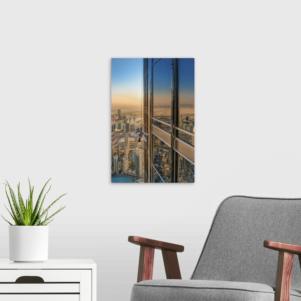 A modern room featuring Abstract view of a cityscape with a skyscraper window reflecting the surrounding buildings.