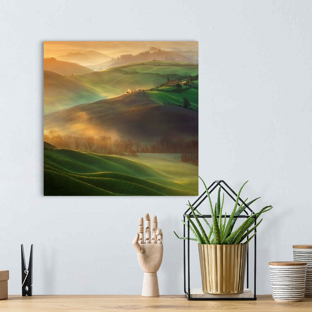 A bohemian room featuring A Tuscan countryside landscape bathed in early morning light and low lying fog.