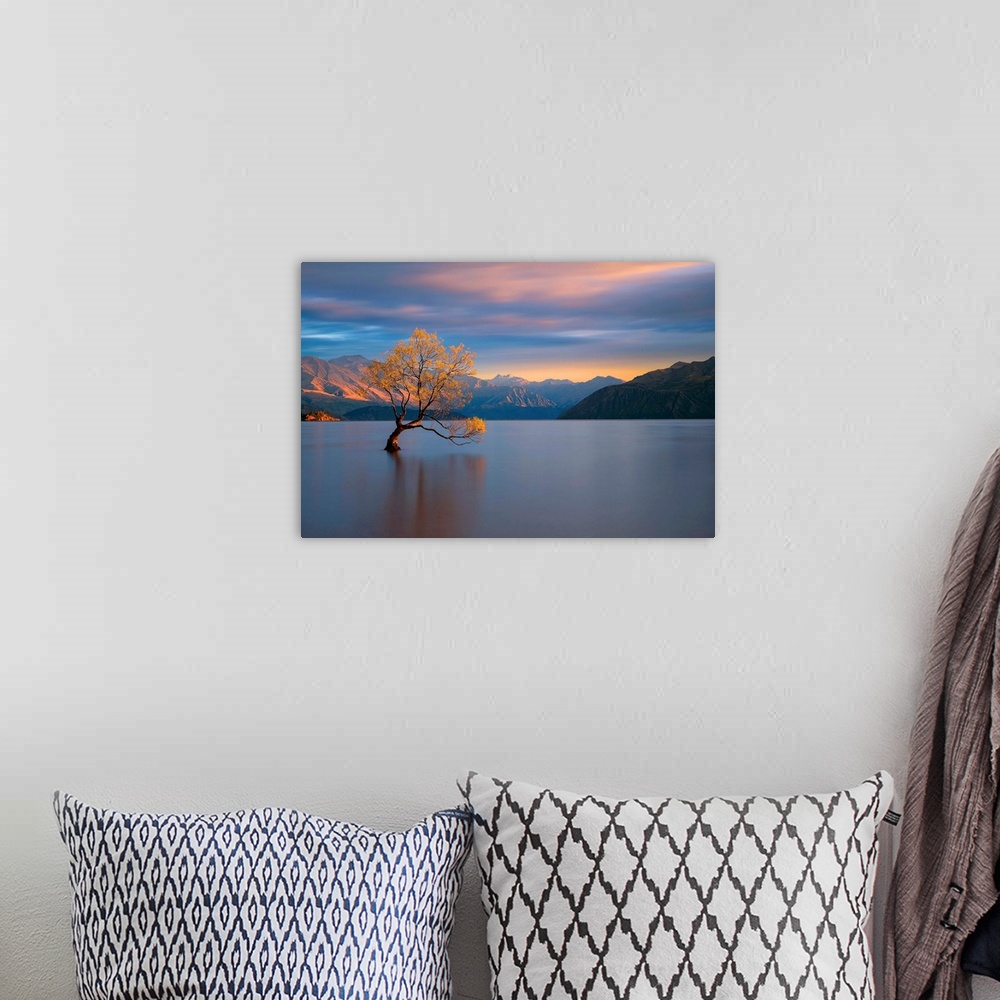 A bohemian room featuring Landscape photograph of calm water and mountains with a yellow leafed tree at sunrise in Wanaka, ...