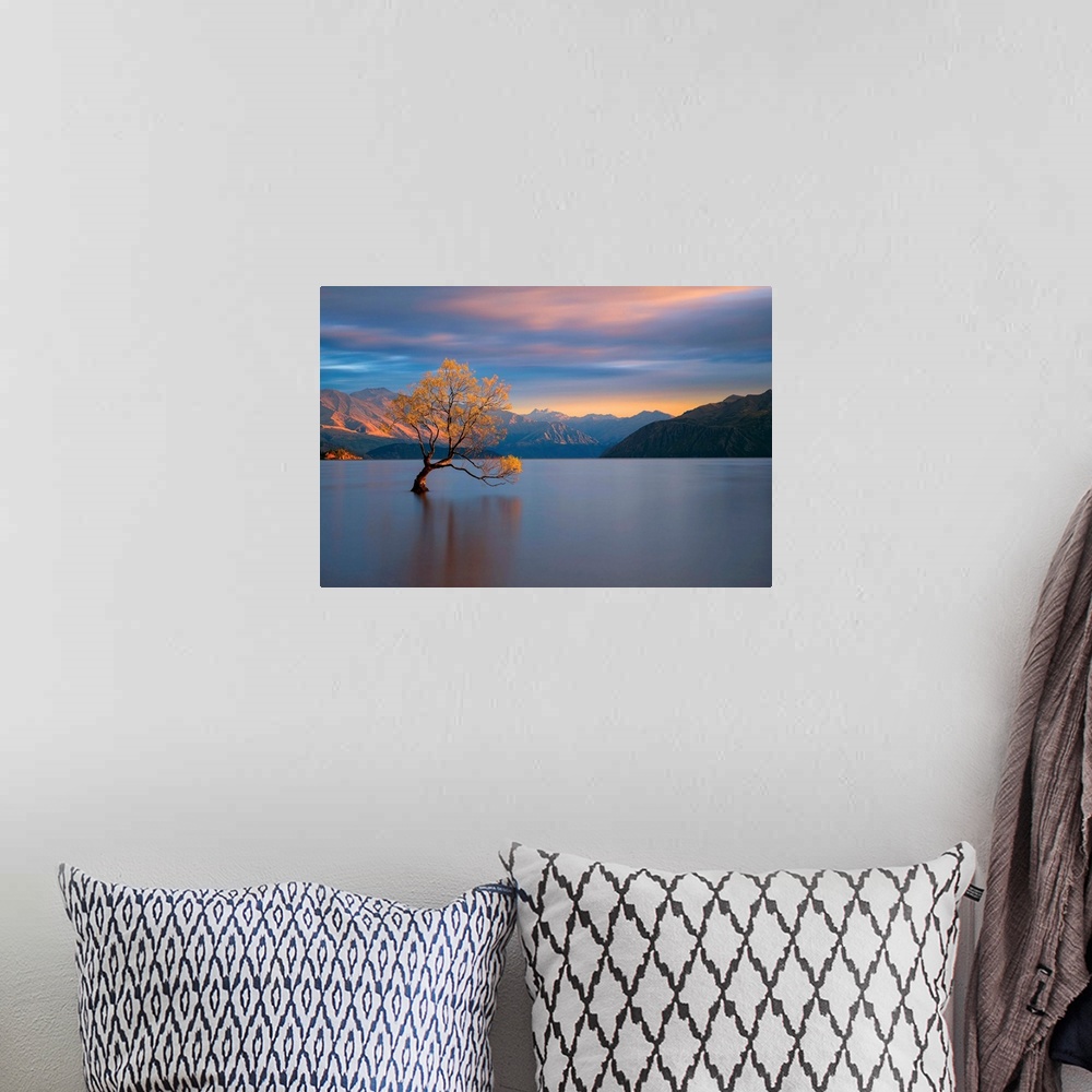A bohemian room featuring Landscape photograph of calm water and mountains with a yellow leafed tree at sunrise in Wanaka, ...