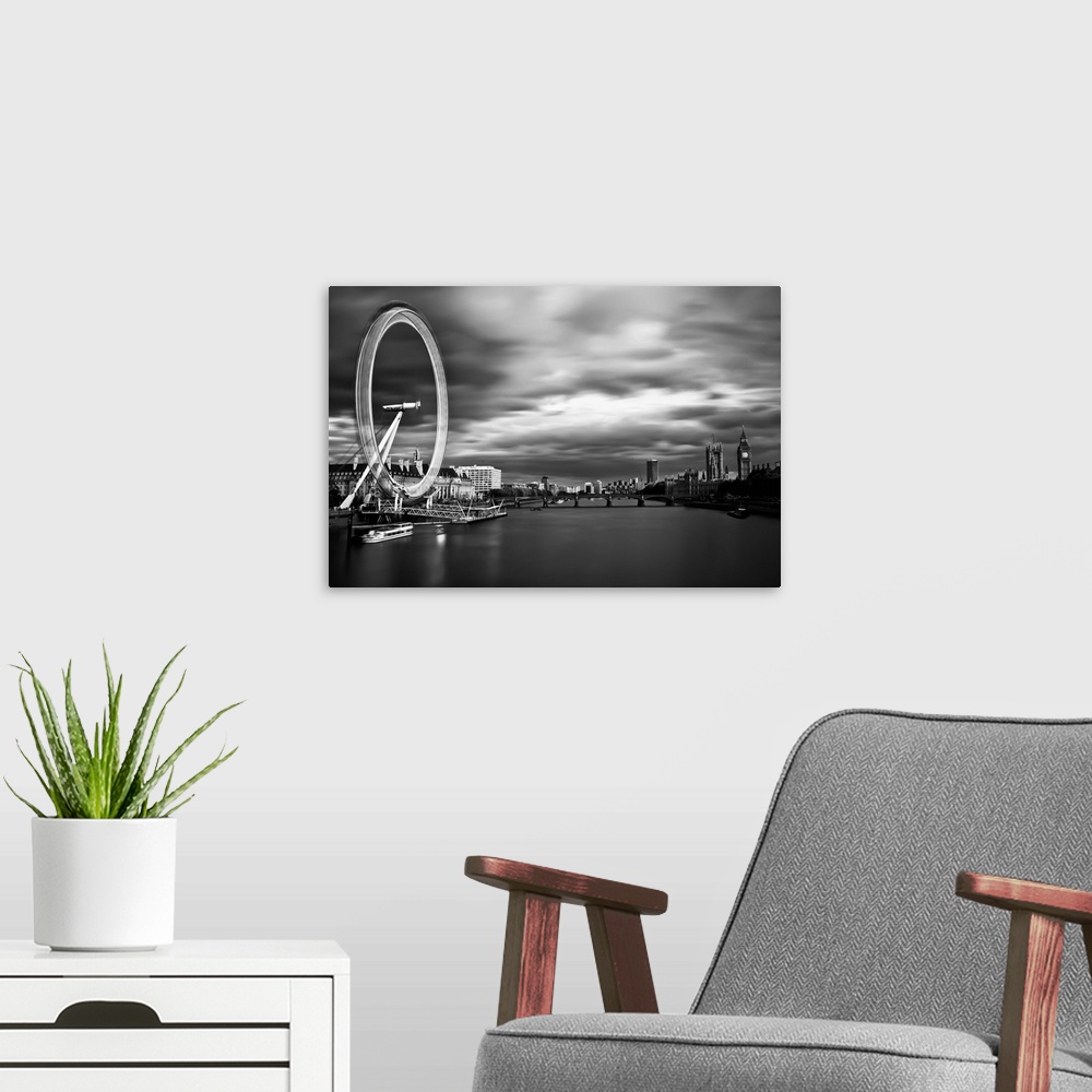 A modern room featuring Long exposure of the London skyline, with the London Eye in motion and Big Ben in the distance.
