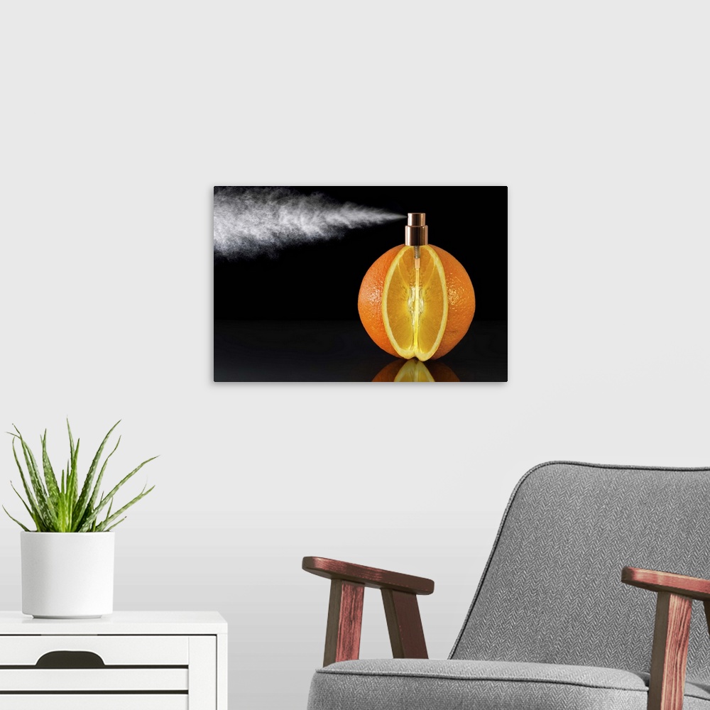A modern room featuring Conceptual photograph of an orange with a wedge cut of it and a spray nozzle fitted to the top of...