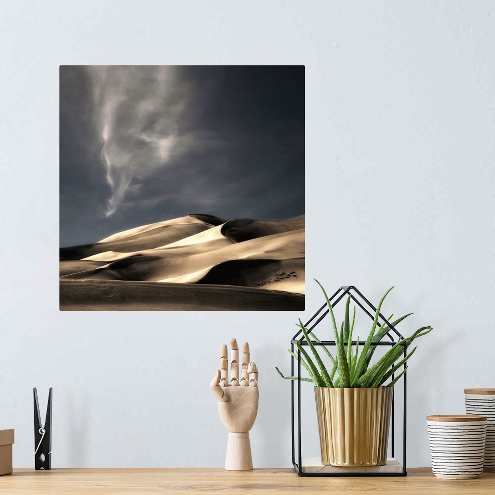 A bohemian room featuring Desert sand dunes casting deep shadows under a darkening sky, Colorado.