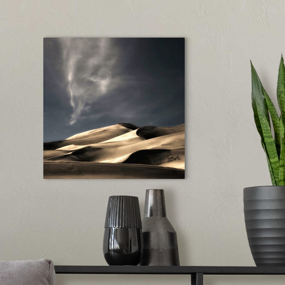 A modern room featuring Desert sand dunes casting deep shadows under a darkening sky, Colorado.