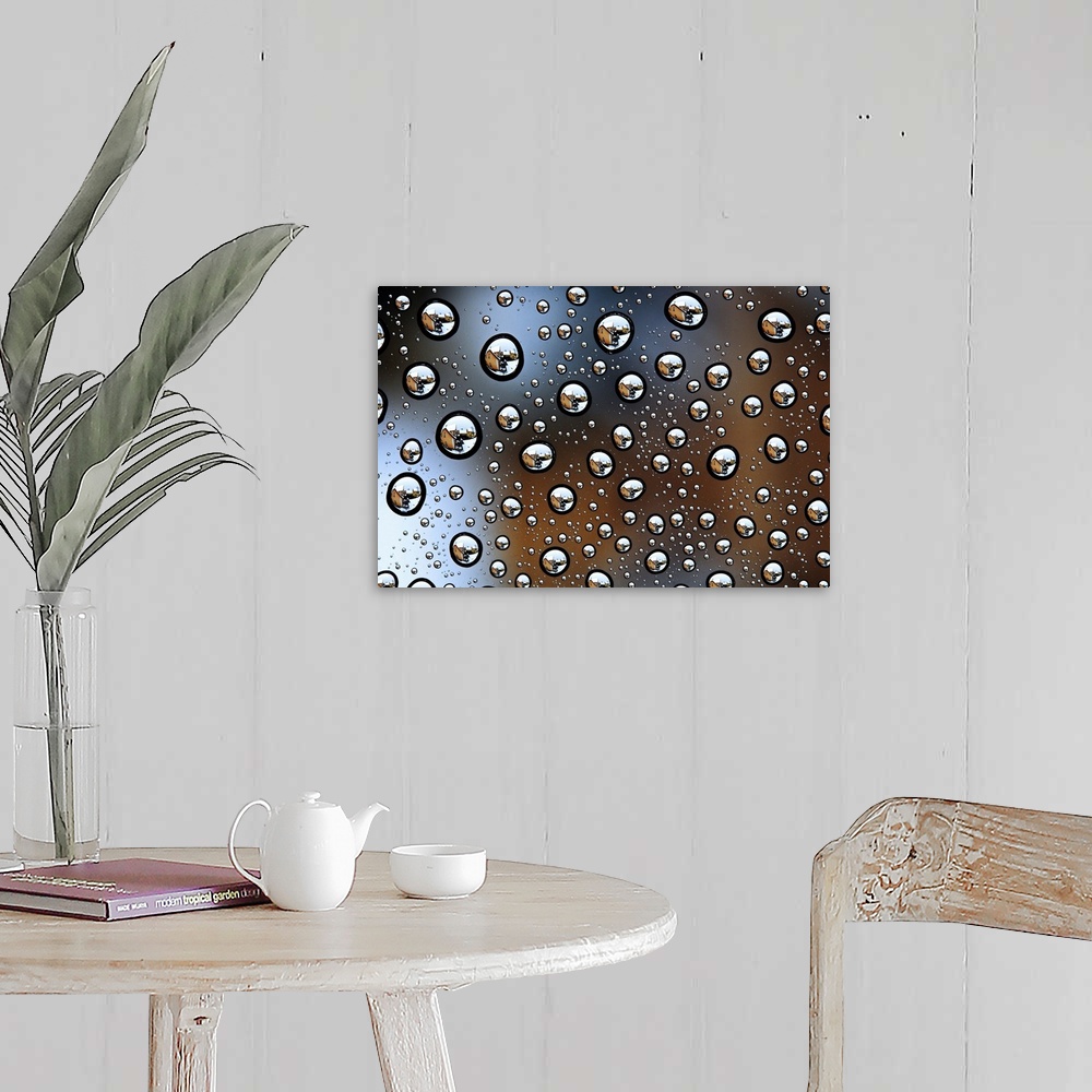 A farmhouse room featuring Image of a house reflected several times in tons of water droplets.