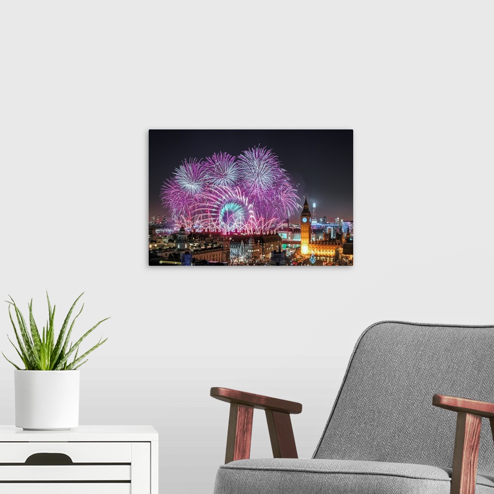 A modern room featuring Huge fireworks display over Paris on New Year's Eve.