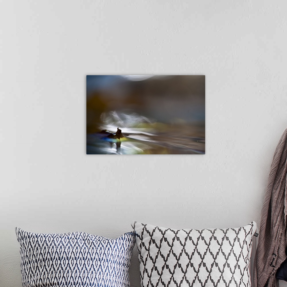 A bohemian room featuring Abstract digital art resembling a waterscape.