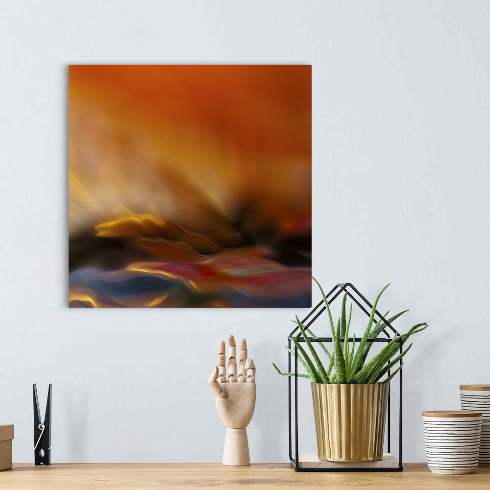 A bohemian room featuring Abstract photograph with motion blur resembling a fire.