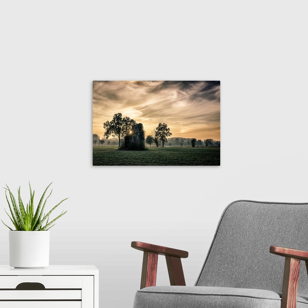 A modern room featuring Old abandoned house in a field of the Pianura Padana (Nord Italy) at sunset under cloudy sky. Hou...