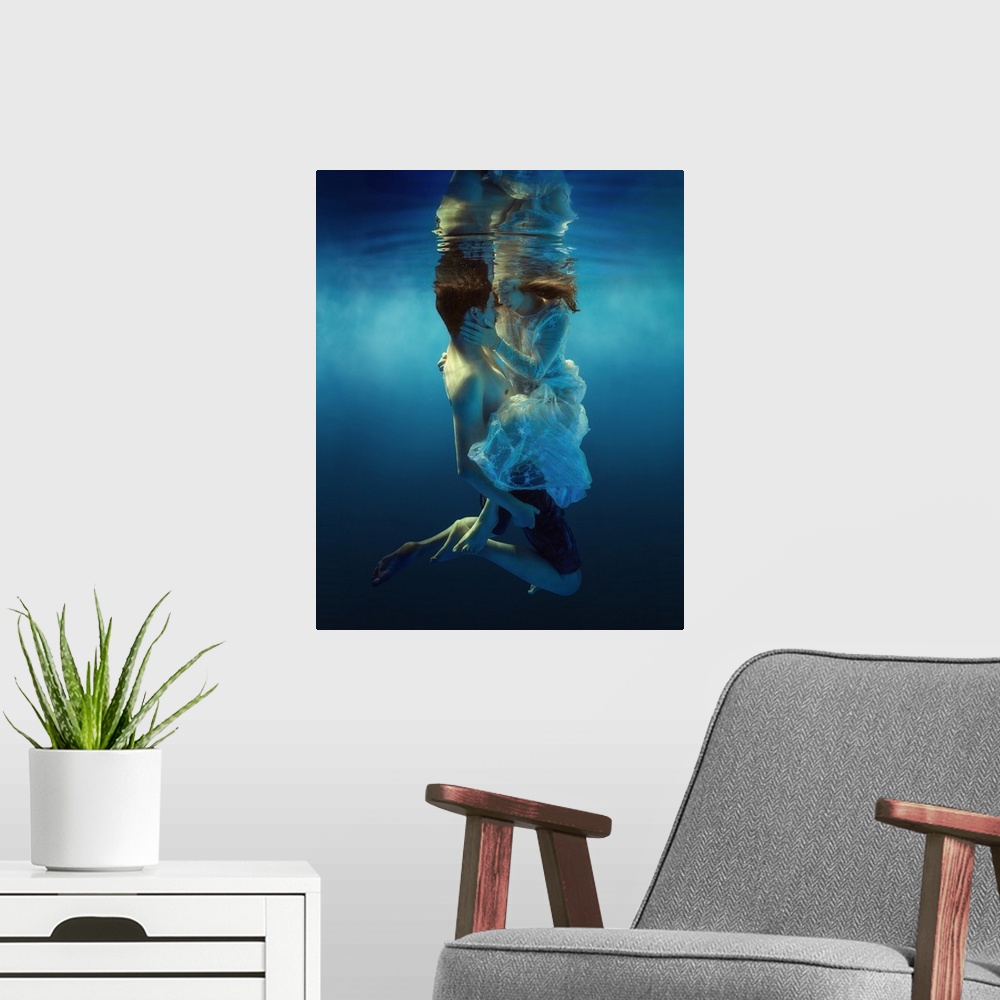 A modern room featuring Underwater portrait of a man and woman holding each other, about to kiss.