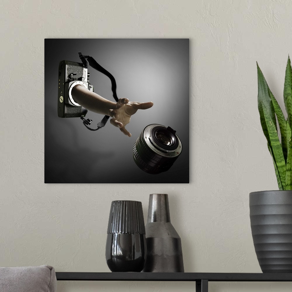A modern room featuring Conceptual image of an arm reaching out of a film camera towards a falling lens.