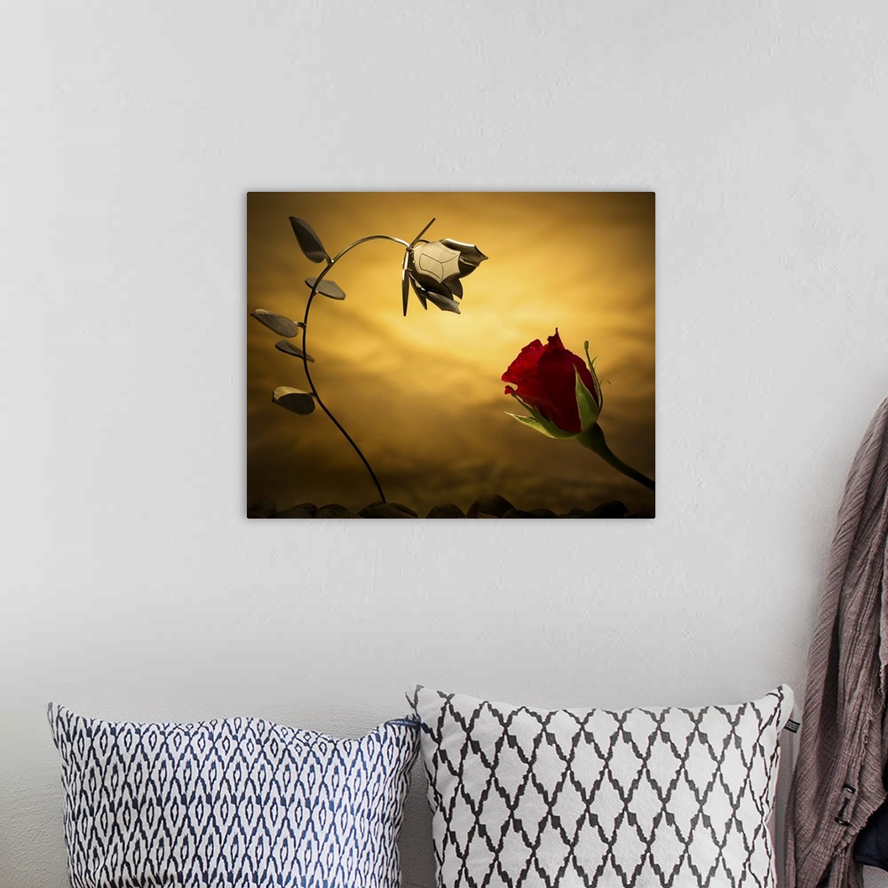 A bohemian room featuring Conceptual photo of a real rose and one made out of metal.