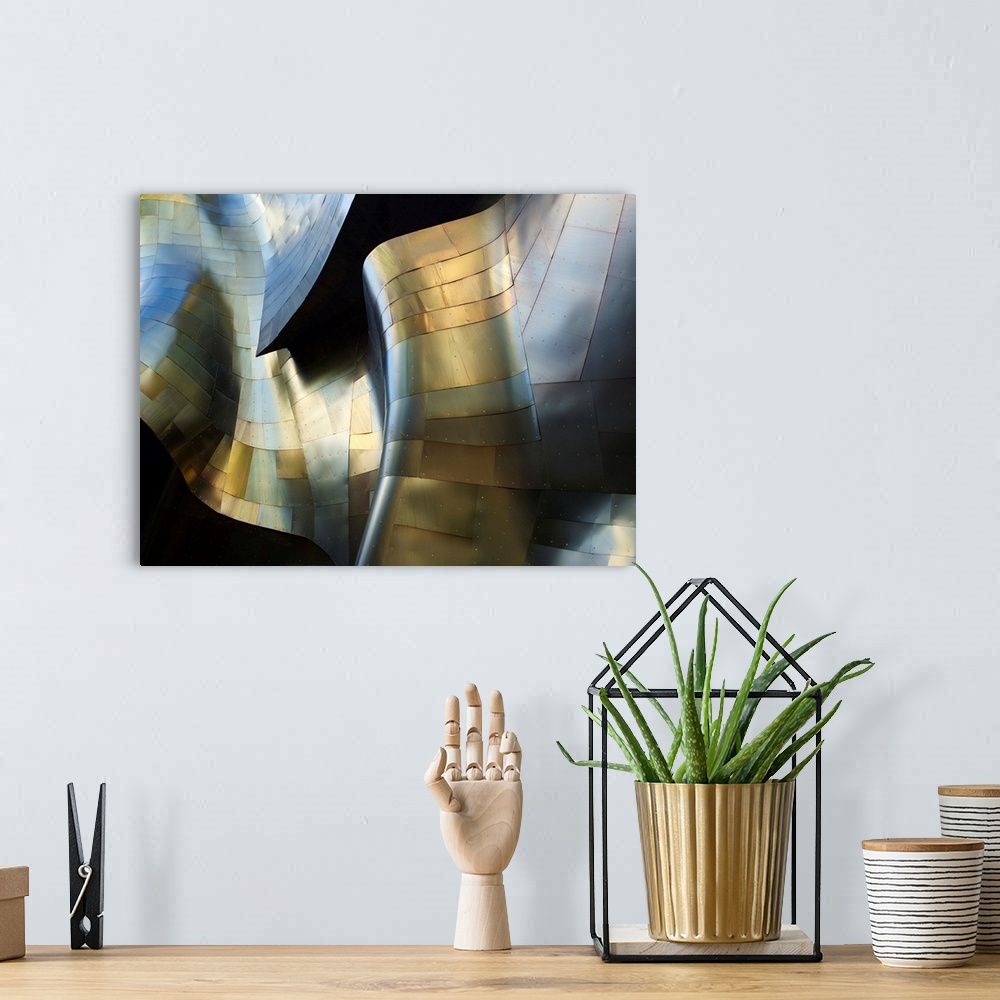 A bohemian room featuring A photograph of an abstract view of a curved metal building facade.