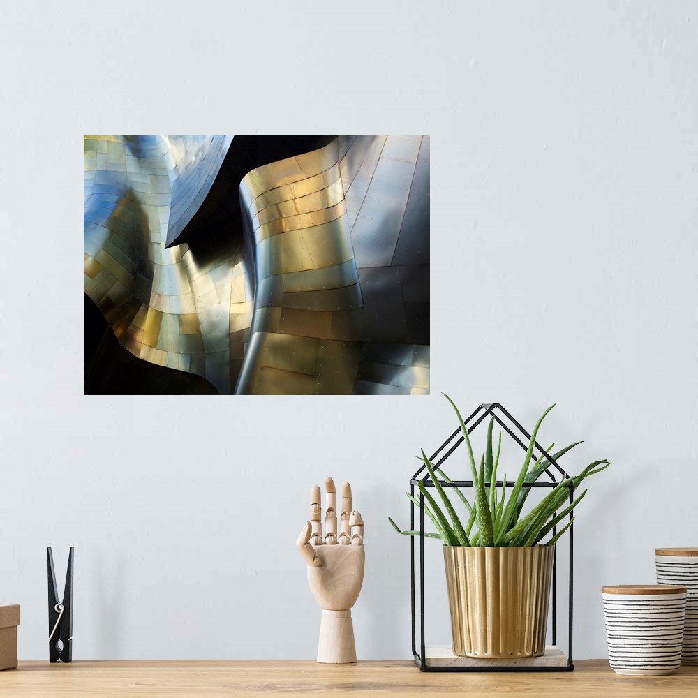 A bohemian room featuring A photograph of an abstract view of a curved metal building facade.