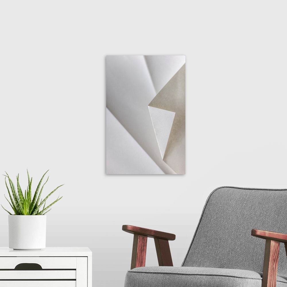 A modern room featuring A close up photograph of a folded piece of origami paper