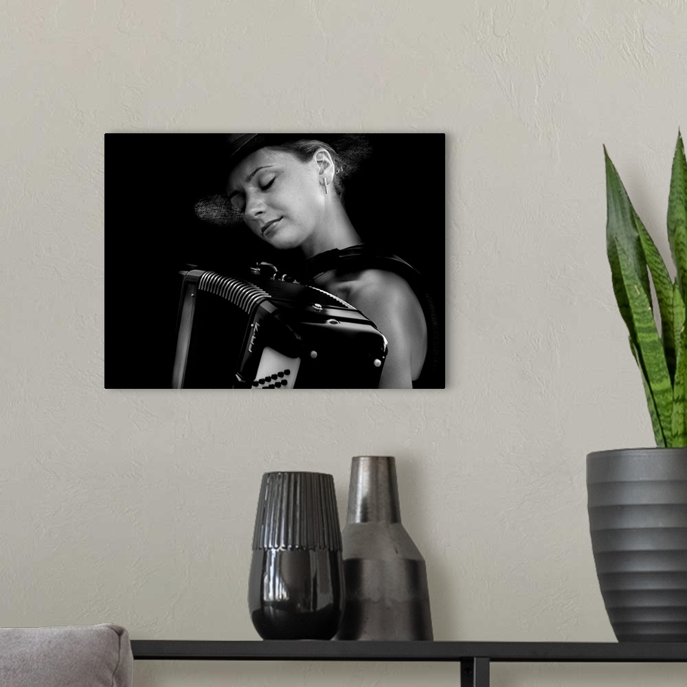 A modern room featuring Woman smiling as she plays her accordion.