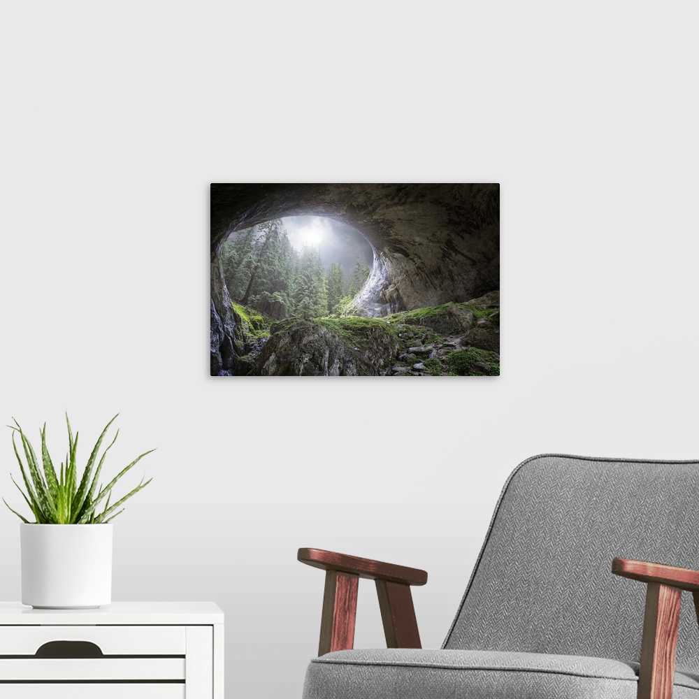 A modern room featuring Wide natural arch of a cave in a forest, in Marvelous Bridges, Bulgaria.