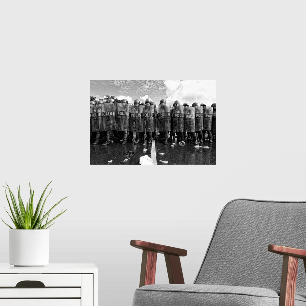 A modern room featuring A black and white photograph of a police barricade.