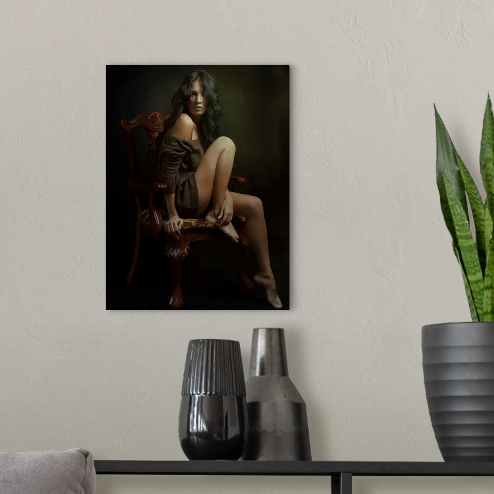 A modern room featuring Portrait of a stunning woman with long dark hair in an ornate chair.