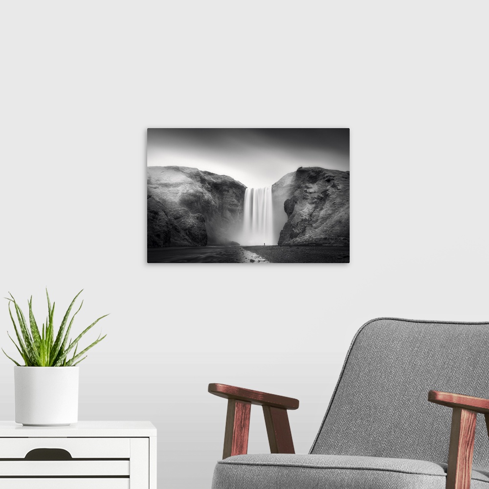 A modern room featuring A photograph of an ethereal waterfall in Iceland.