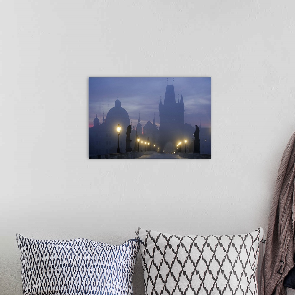 A bohemian room featuring Charles Bridge in Prague in the early morning mist.