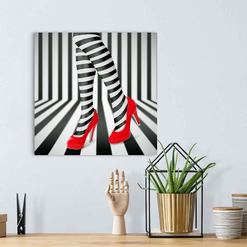 A bohemian room featuring Woman's legs wearing black and white striped leggings and bright red high heels, against a matchi...