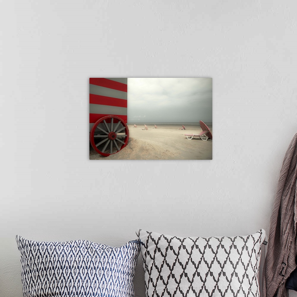 A bohemian room featuring Beach scene with umbrellas and a red striped beach hut.