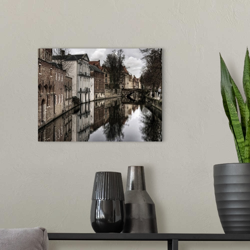 A modern room featuring Canal in the city of Bruges, Belgium, on a cloudy day in the winter.