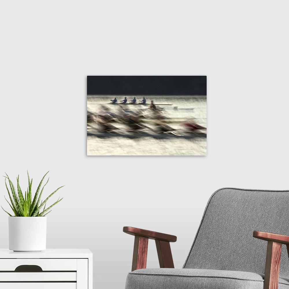 A modern room featuring Long exposure photograph of rowing teams in a lake.