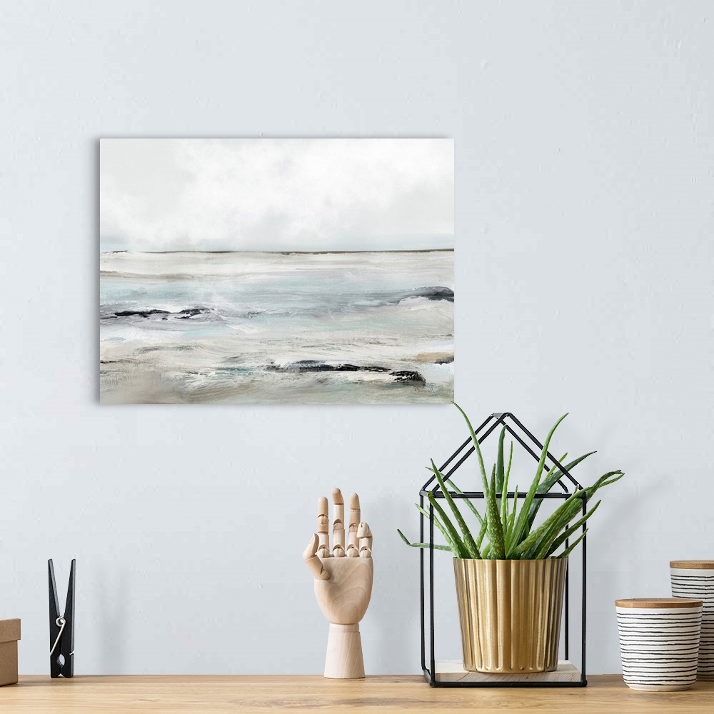 A bohemian room featuring A contemporary abstract seascape with waves washing over dark rocks under a grey sky. Perfect for...