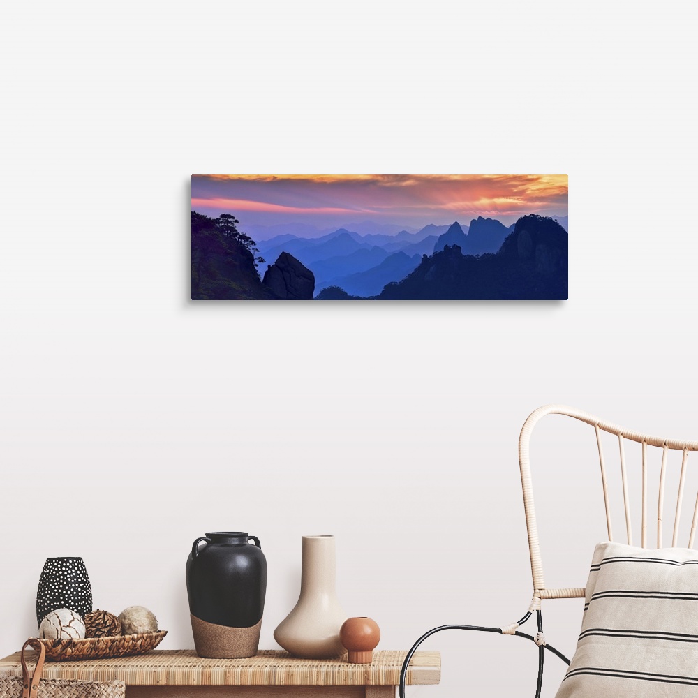 A farmhouse room featuring Beautiful, colorful panoramic landscape of Mount Sanqing, China at sunset.
