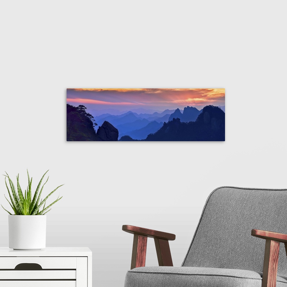 A modern room featuring Beautiful, colorful panoramic landscape of Mount Sanqing, China at sunset.