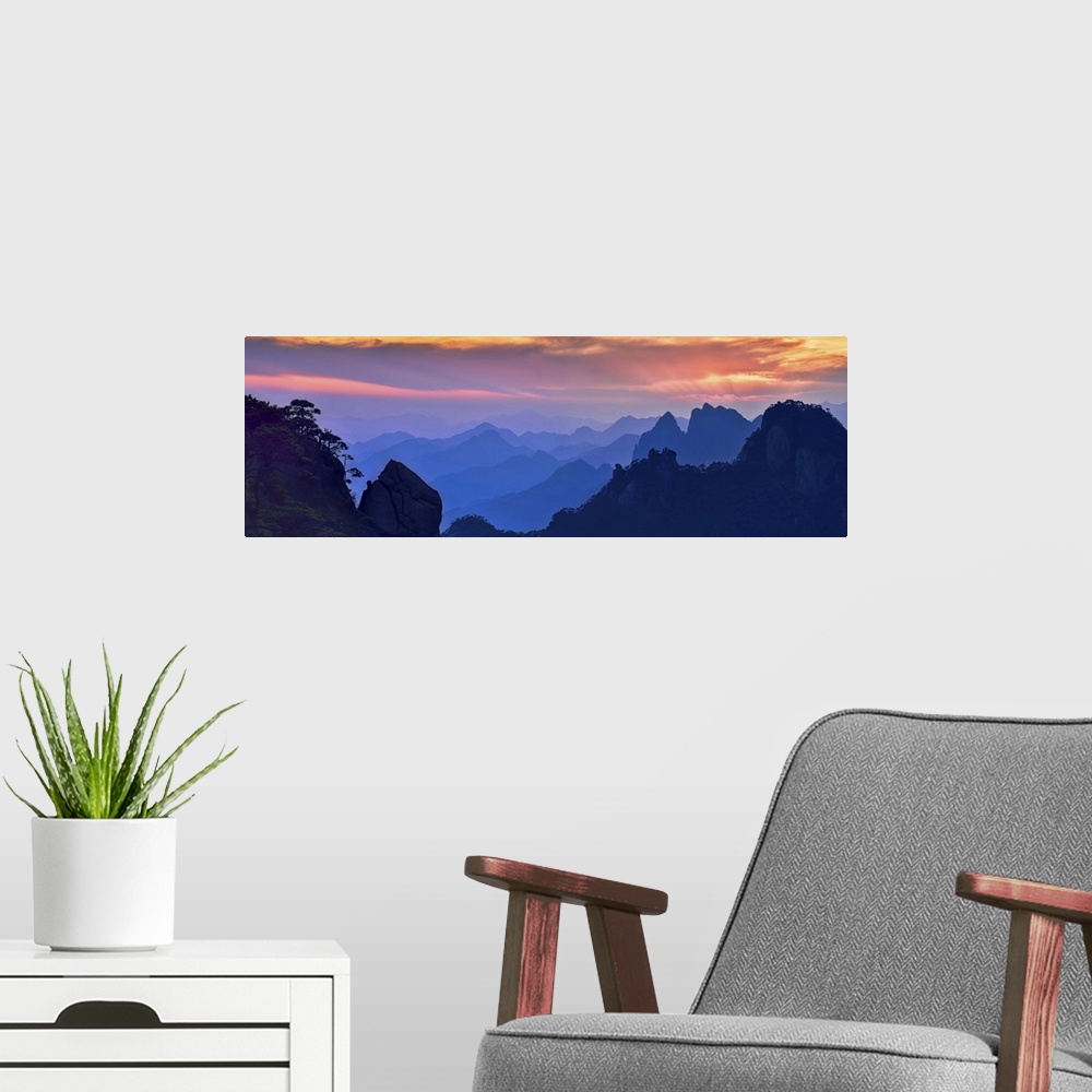 A modern room featuring Beautiful, colorful panoramic landscape of Mount Sanqing, China at sunset.