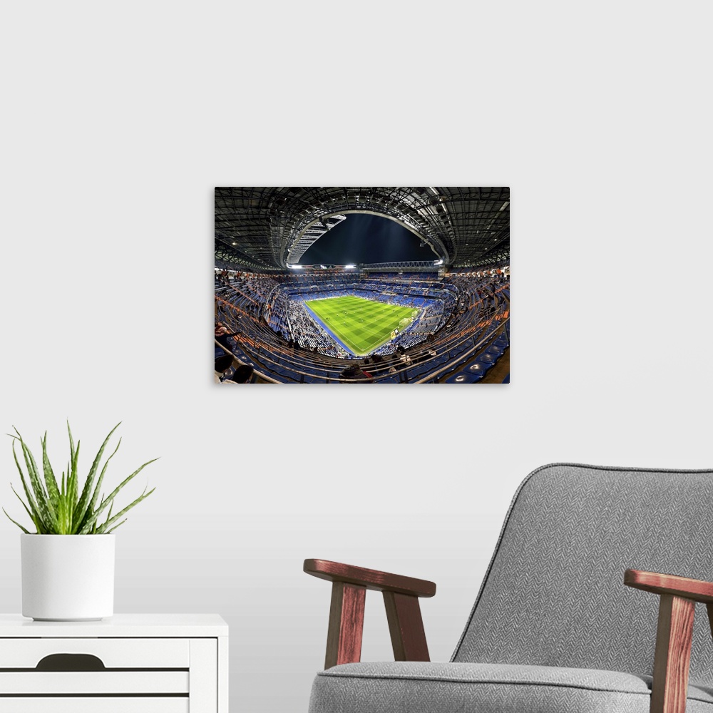 A modern room featuring Wide-angle view of the inside of the Madrid Football Stadium, Spain.