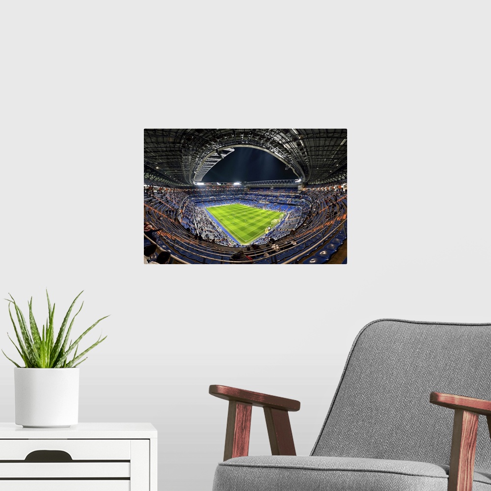 A modern room featuring Wide-angle view of the inside of the Madrid Football Stadium, Spain.