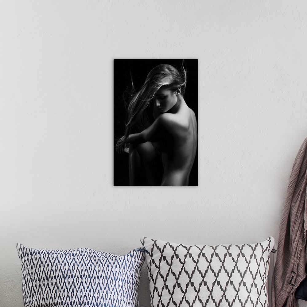 A bohemian room featuring Black and white portrait of a beautiful nude woman.