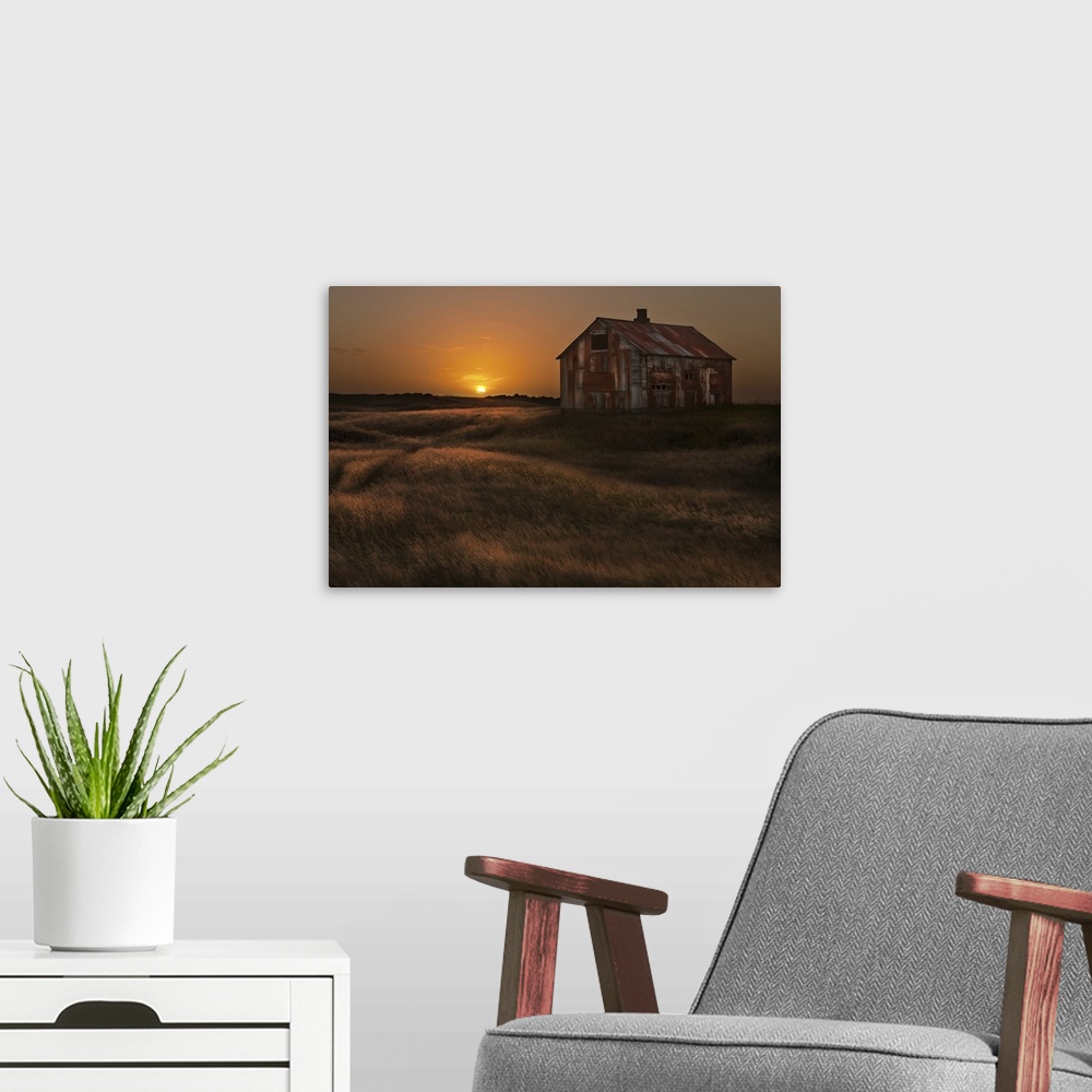 A modern room featuring A rusted abandoned house in a grassy landscape at sunset, Iceland.